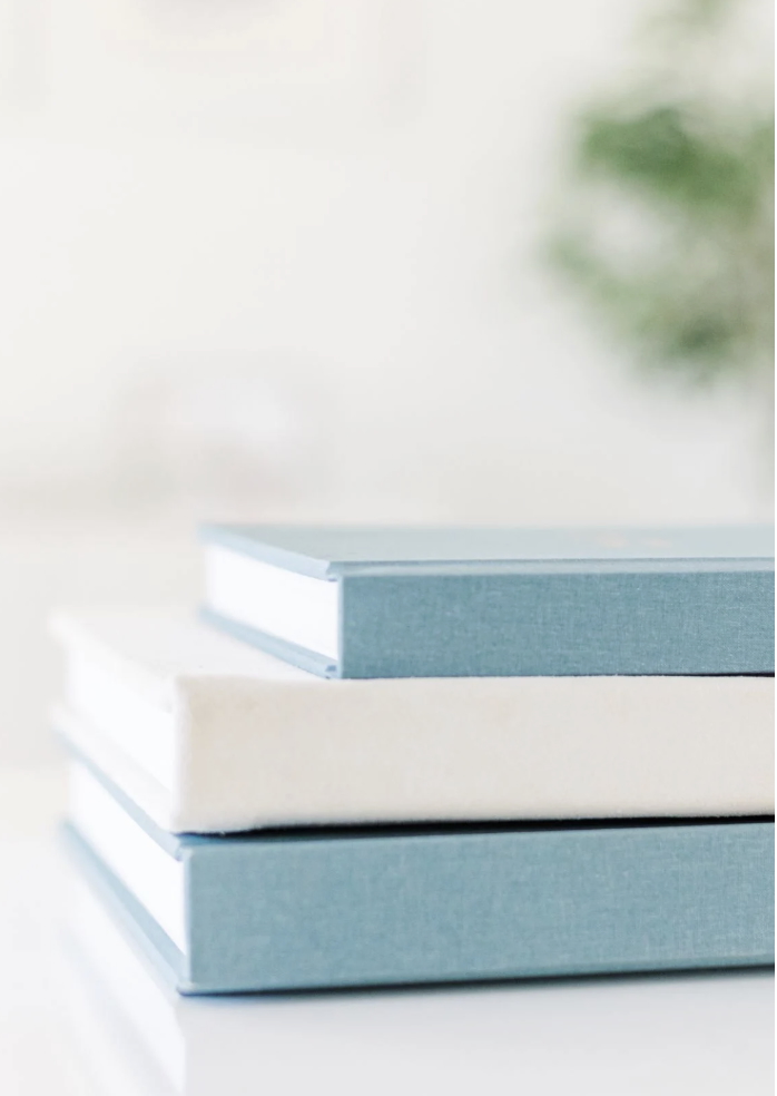 Stacked linen wedding albums