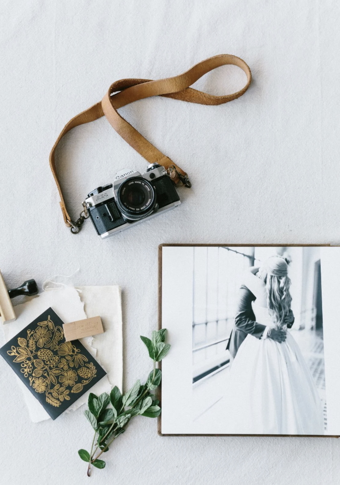 Open wedding album print with botanicals