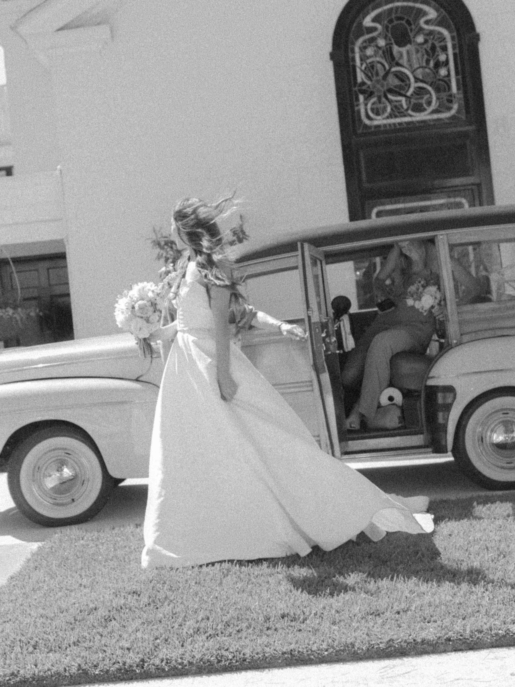 Bride arriving in vintage car