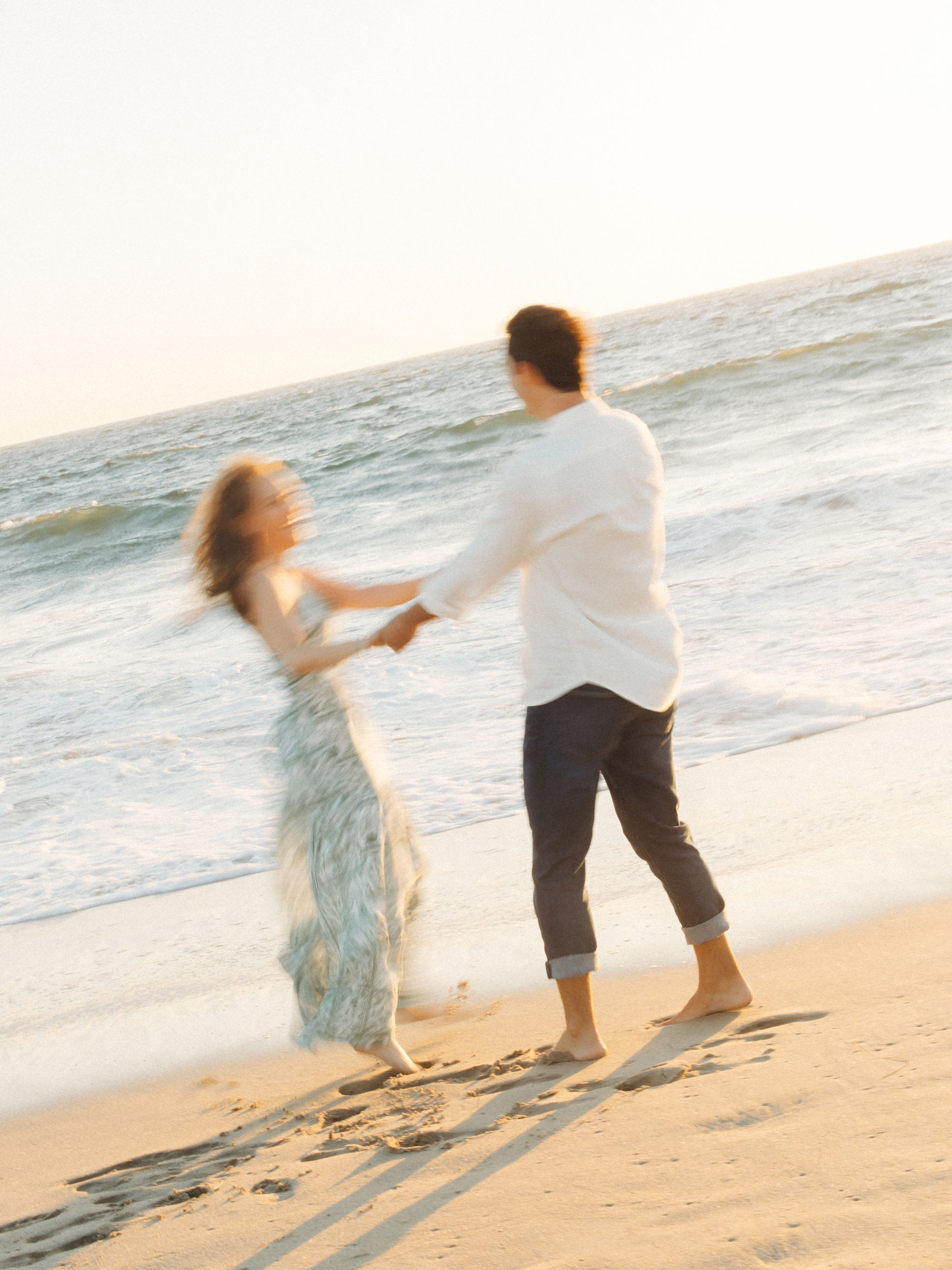 Romantic beach portraits after proposal